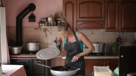 Dog owner preparing a meal